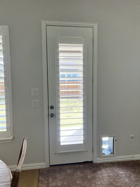 Plantation shutter on a door window