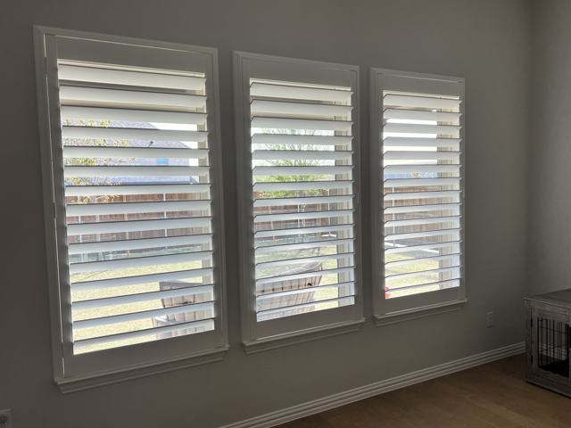 Plantation shutters on a triple window